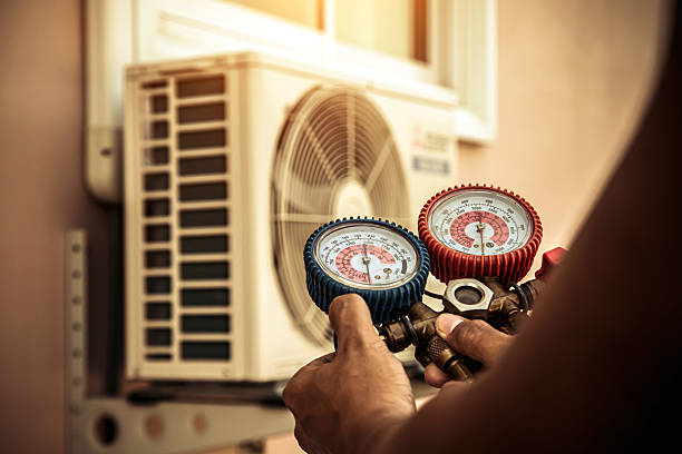 Professional Hvac technician working in Fayetteville, AR